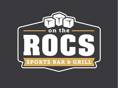 On The ROCs badge black black white brand gold grill ice cubes on rocs sports bar the