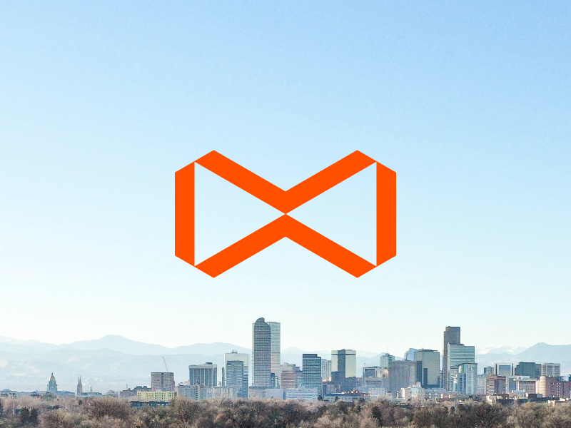 To infinity... strategy development real estate power brand skyline bow tie construction denver logo mark orange infinity