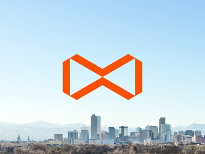 To infinity... bow tie brand construction denver development infinity logo mark orange power real estate skyline strategy