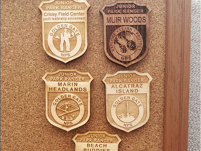 Junior Ranger Badges alcatraz badges branding and identity design illustration illustrator cc jr ranger jr ranger badge junior ranger laser engraved muir woods national park service national parks sustainable vector artwork