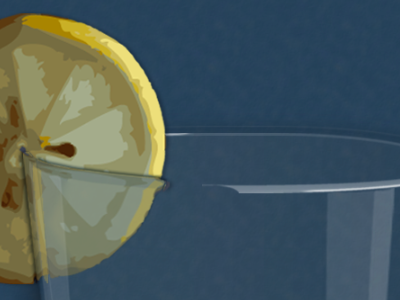 Lemon wedge on the rim of a highball glass