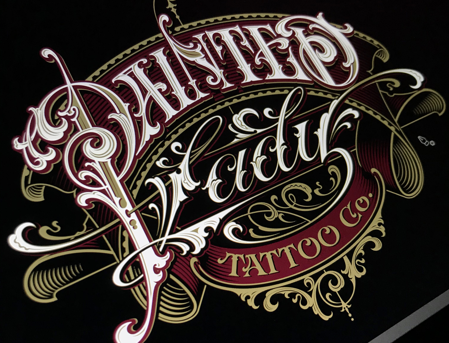 Premium Vector  Vintage luxury tattoo studio lettering logo with  decorative ornamental frame