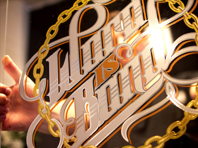 close up Word chain custom drawn glass gold hand letters lock logotype schmetzer sign typography