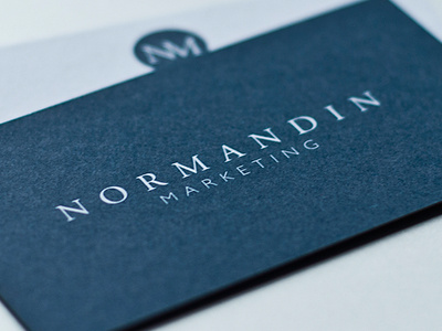 Normandin Marketing blue business card typography