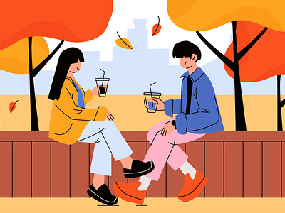 Couple sitting on a bench under the trees in the fall