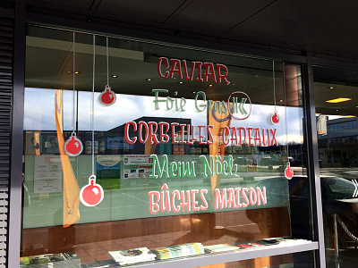 Christmas window sign painting with acrylic markers