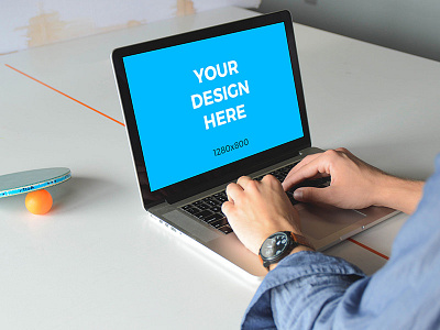 Man working on MacBook Pro on ping pong table free macbook man mockup smartmockups