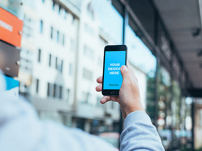 Free mockup - Man holding black iPhone 6S