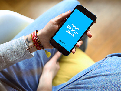 Woman sitting in a chair with iPhone 6S - Free Mockup