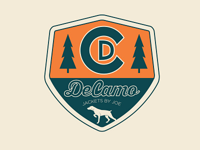 DeCamo badge blue clothing dog hunt logo orange script tree type