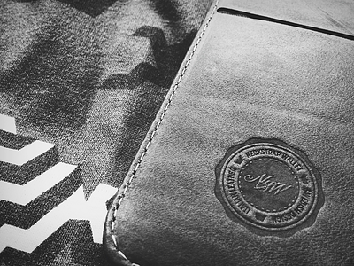 NSW logo - leather embossed