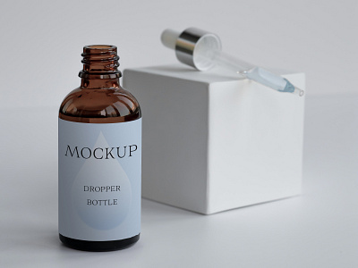 Dropper bottle mockup PSD bottle design branding cosmetic cosmetic design design dropper bottle glass bottle label design logo mockup packaging packaging design psd serum bottle smart object template