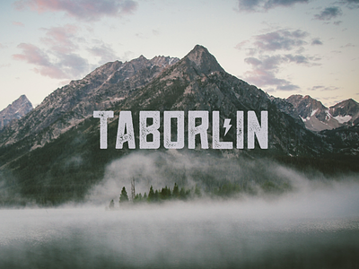 Taborlin the Great Logo bolt brand fog green lightning logo mountain namer taborlin unsplash