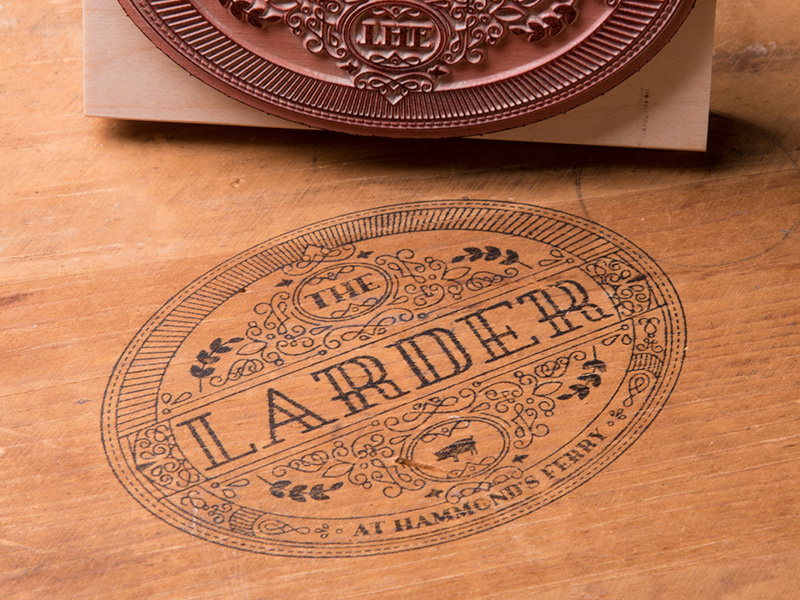 The Larder At Hammond's Ferry stamp pig line art seal restaurant logo