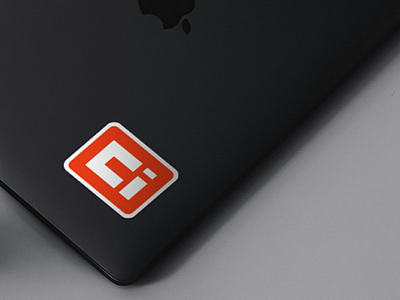 Unbox Innovations logo design as Sticker on MacBook