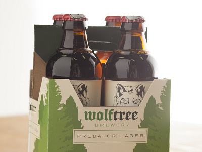 Predator Lager 4 Pack beer bottle cardboard green label mark packaging photo product tree wolf wolftree