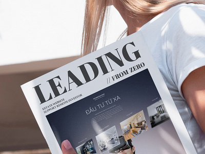 realtor ads magazine on girl hand branding real estate