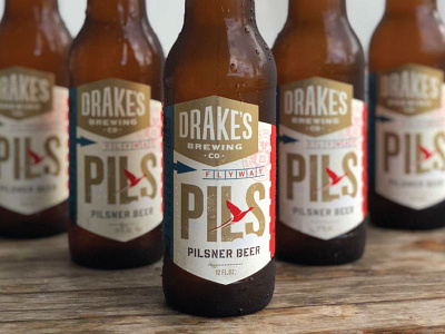 Drakes - Flyway Pils beer drakes duck fly industrial luggage tag pilsner