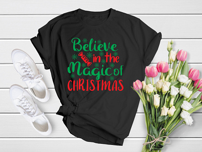 Believe in the Magic of Christmas | Merry Christmas T-Shirt Desi 25 apparel bell christmas christmas design christmas time christmas tree christmas tshirt december deer merry merry christmas noel santa shirt t shirt t shirt tee tree xmas