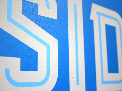 MKE Type Exhibit—Detail from East Side blue clean exhibit design geometric paint sign typeface typography