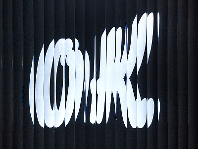 Behind Glass - OK black brush brush lettering distortion fluted flutedglass glass ok photographic script sliced type typography white