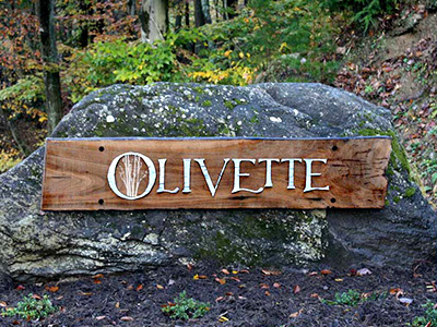 Olivette Entrance Sign agrihood asheville french broad river nature nc olivette outdoors photo river rock sign wood