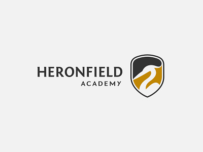 Heronfield Academy academy branding children education emblem graphic design heron kids learning logo orange school shield wisdom