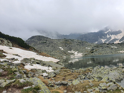 Foggy lake and mountains