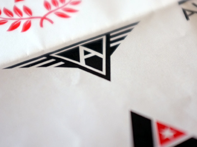 Alpha — No.2 black logo triangle wings