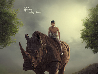 Child riding a rhino advance photo manipulation animal in forest big animal big rhino bold character poster brave child child in forest child riding an animal child sitting on rhino fantasy photo editing fantasy photo manipulation forest graphic design movie poster outdoor picture editing photo manipulation rhino