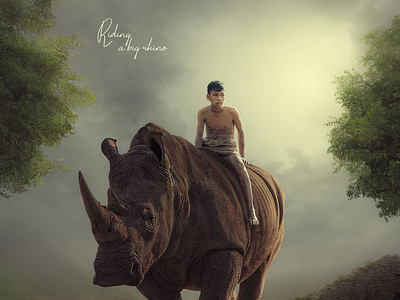 Child riding a rhino