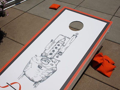 Cornhole game created for New Riff Distillery cornhole illustration pot still whiskey yard game