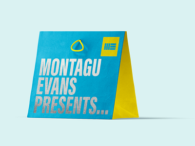 Montagu Evans gift bag blue brand brand design brand identity branding design foil gift property typographic typography yellow