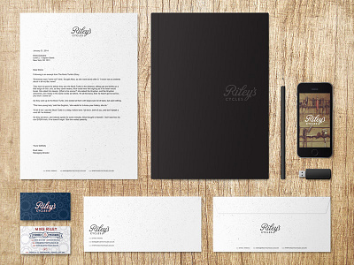 Riley's Cycles Branding & Stationery Mockups bikes branding gears identity letterhead logo rustic script traditional vintage