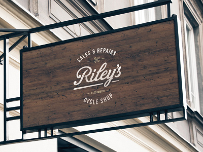 Riley's Cycles Signage brand branding lettering logo script shop sign signage traditional typography vintage wood