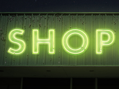 Neon dilapidated futura glowing green neon shop sign signage store storefront