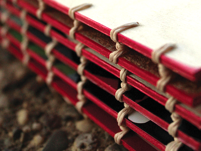 BINDING BY HAND art binding book book binding fine red rope twine wood