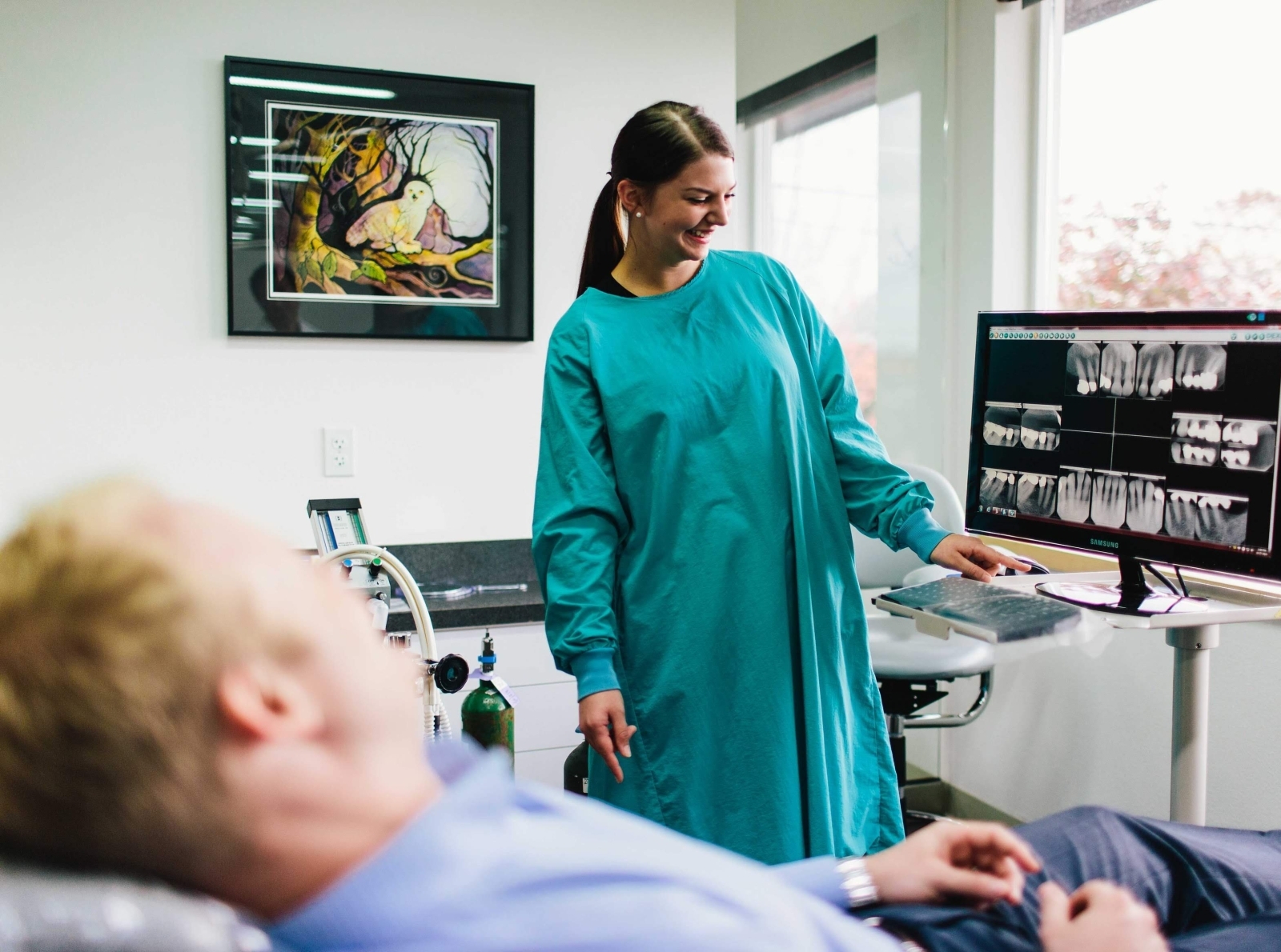 Dental crown and root canal patient viewing his x-ray images at by