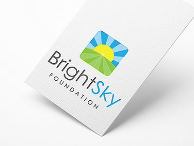 BrightSky Foundation blue branding green logo logo design non profit sun sunrise white yellow