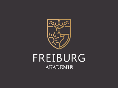 Freiburg Akademie Sprachschule academy eagle education freiburg germany gradudation hat logo olive shield sun university