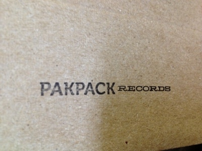 Getting promos ready album cardboard hold on photon logo mailer music records simple stamp type typography