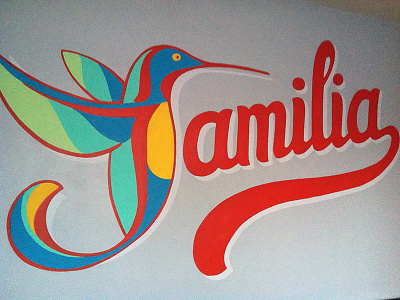 Familia Mural colorful familia hummingbird mural orange paint script swoosh