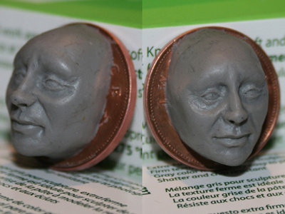 Polymer clay face on coin