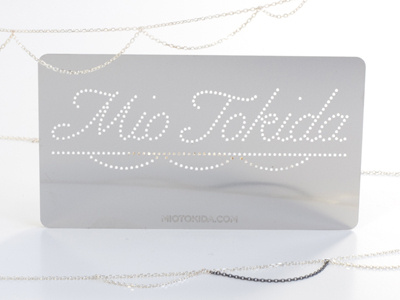 Mio Tokida cursive die cut etched identity jewelry lettering metal perforated pixel script type typography