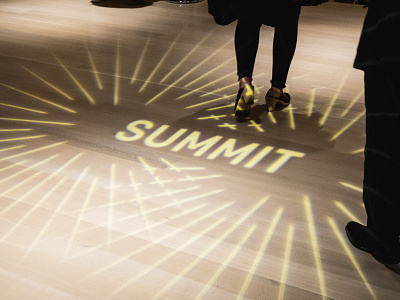 Light Projection at Summit Conference brand bursts collision conference floor light logo projection type