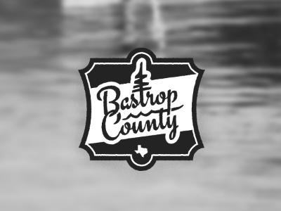 Bastrop County logo brush script texas type