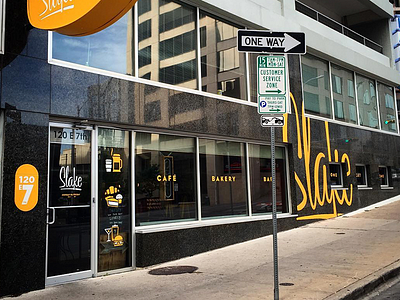 Slake Café façade… arrow austin façade norma jeanne rebrand red rider studios sign painting signage slake café visual identity