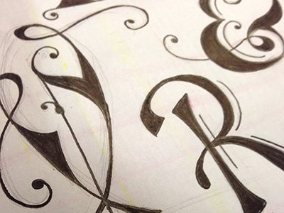 Practicing hand lettering flourish hand ink letterforms lettering typography