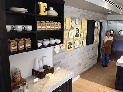 Ellie's Story Wall antique apron bakery cafe coffee cup ellies frames packaging plates story wall