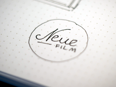 Neue Film branding logo neue film paper pen sketch